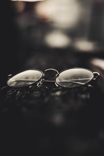 Grayscale Photography Of Folded Eyeglasses