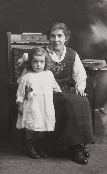 Grayscale Photography of Girl and Woman Sitting on Chair