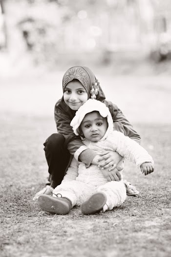 Grayscale Photography Of Girl Hugging Baby