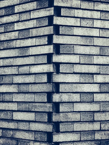 Grayscale Photography of Gray Brick Wall
