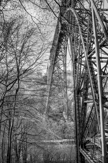 Grayscale Photography of Gray Metal Arch Tower