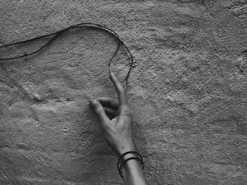 Grayscale Photography of Human Hand Pointing Black Tie