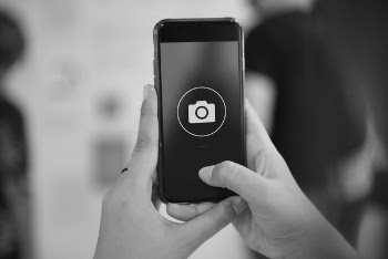 Grayscale Photography of Iphone Displaying Camera