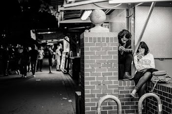 Grayscale Photography of Man Beside Woman Who Use Smartphone