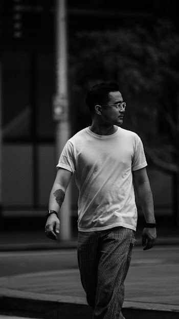 Grayscale Photography of Man Crossing the Street