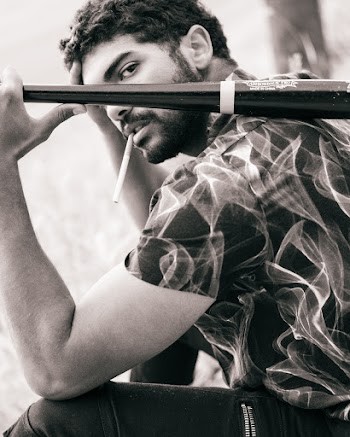 Grayscale Photography Of Man Holding Baseball Bat