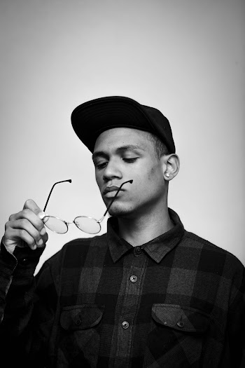 Grayscale Photography of Man Holding Eyeglasses
