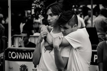 Grayscale Photography of Man Hugging Each Other