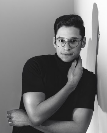 Grayscale Photography of Man Leaning on Wall