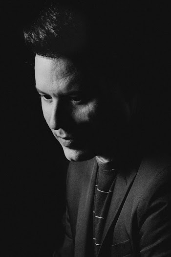 Grayscale Photography of Man Looking down