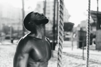 Grayscale Photography of Man Looking Up