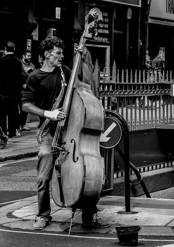Grayscale Photography of Man Playing Cello