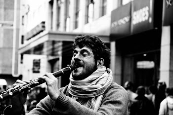Grayscale Photography of Man Playing Clarinet