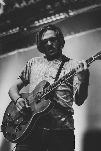 Grayscale Photography of Man Playing Guitar