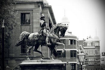 Grayscale Photography of Man Riding Horse Statue