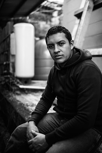 Grayscale Photography of Man Sitting
