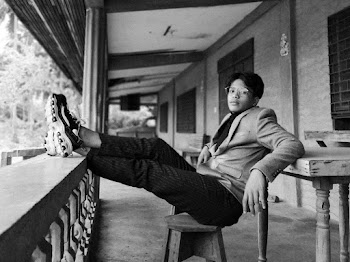Grayscale Photography of Man Sitting on Chair