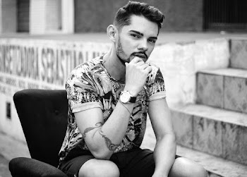 Grayscale Photography of Man Sitting on Sofa Chair