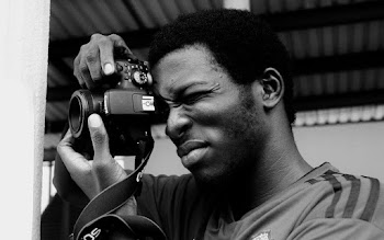 Grayscale Photography of Man Taking Photo
