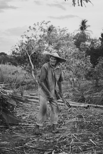 Grayscale Photography of Man Wearing A Hat