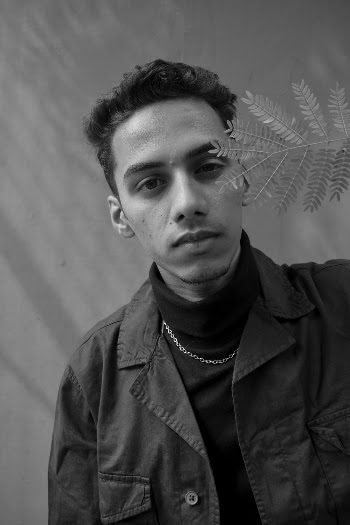 Grayscale Photography of Man Wearing Black Collared Shirt