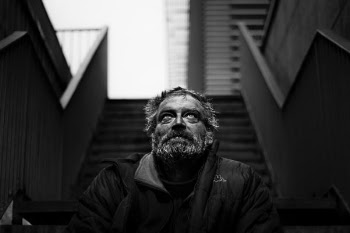 grayscale photography of man wearing black jacket