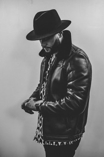 grayscale photography of man wearing black leather jacket