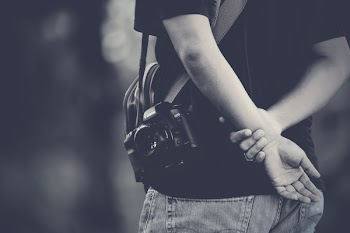 Grayscale Photography of Man Wearing Camera