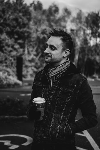 Grayscale Photography of Man Wearing Denim Button-up Jacket