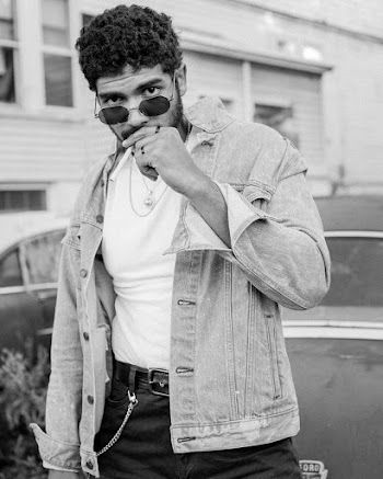 Grayscale Photography Of Man Wearing Denim Jacket
