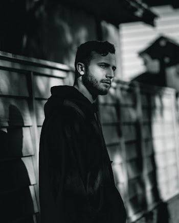 Grayscale Photography of Man Wearing Jacket