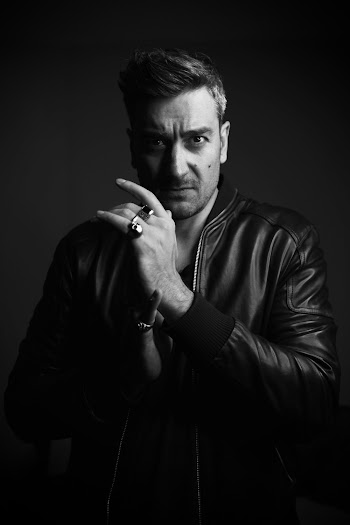 Grayscale Photography of Man Wearing Leather Jacket