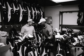 Grayscale Photography Of Men Surrounded By Golf Clubs
