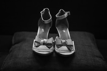 Grayscale Photography of Pair of Open-toe Ankle-strap Bow Accent Sandals