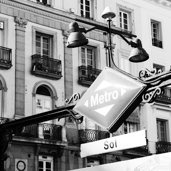 Grayscale Photography of Patio Light and Sign