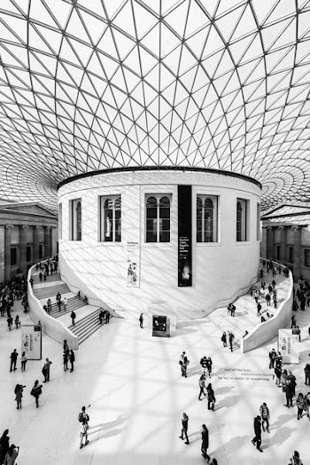 grayscale photography of people inside building