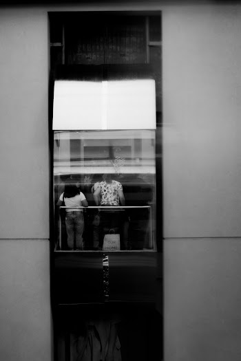 Grayscale Photography of People Inside Elevator