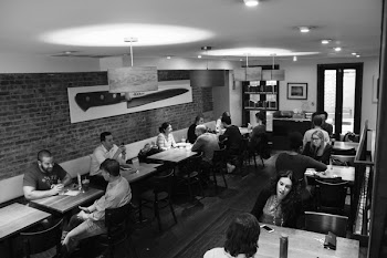 Grayscale Photography of People Inside Restaurant