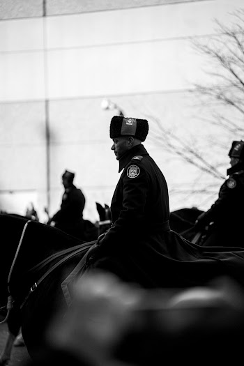 Grayscale Photography of People Riding on Individual Horses