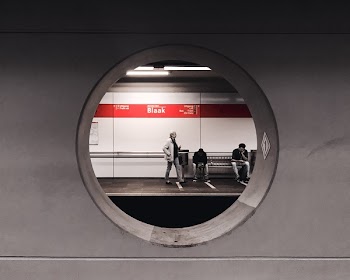 Grayscale Photography of People Waiting in Train Station