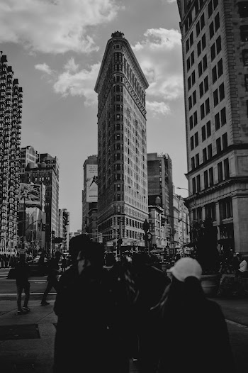 Grayscale Photography of People Walking Along Urban City Streets