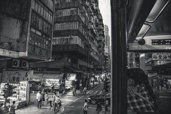 Grayscale Photography of People Walking Near High Rise Buildings