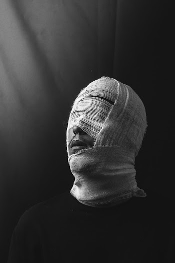 Grayscale Photography of Person's Face Covered With Gauze