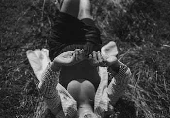 Grayscale Photography of Person Lying on Grass