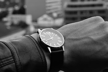 Grayscale Photography of Person Showing Calvin Klein Wtach