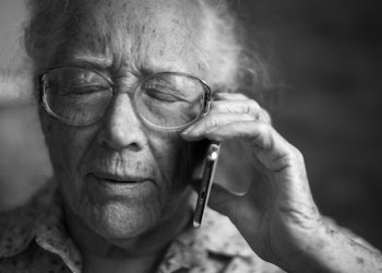 Grayscale Photography of Person Using Phone