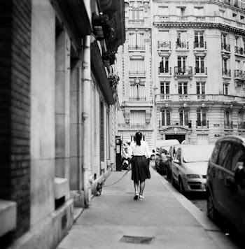 Grayscale Photography Of Person Walking The Dog On Sidewalk