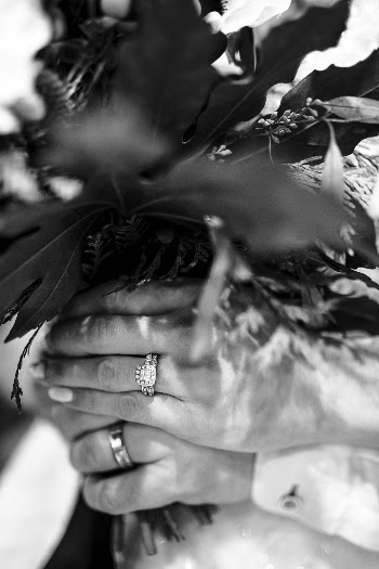 Grayscale Photography of Person Wearing Bouquet