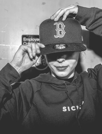 Grayscale Photography Of Person Wearing Fitted Cap With Embroidered Boston Red Sox Logo