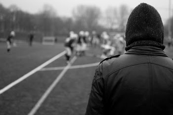 Grayscale Photography of Person Wearing Leather Jacket and Knit Cap